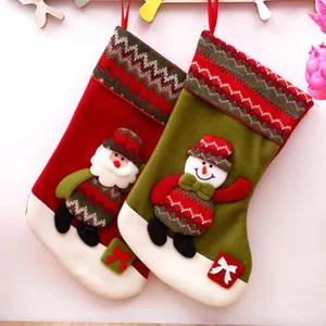 Christmas decoration stockings detail, plush knit material with cute Santa and snowman dolls.