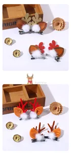 Christmas reindeer antler hair clips with plush pom-poms, cute holiday hair accessories for kids.