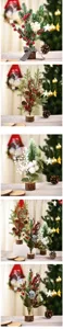 Mini Christmas tree tabletop decoration with wooden base, pine needles, berries and pine cones.