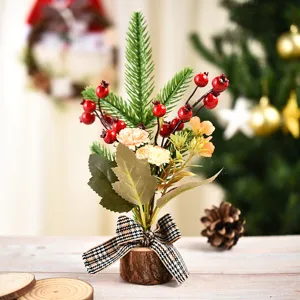 Mini artificial Christmas tree desktop ornament with pine branches, red berries and plaid bow.