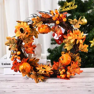 Autumn harvest wreath with artificial sunflowers pumpkins and maple leaves for door home design