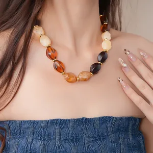 Detailed shot of trendy European American style acrylic geometric beaded necklace for women.