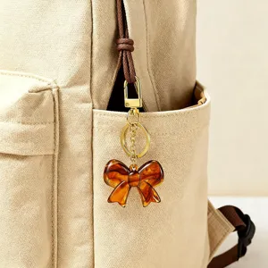 Retro carey lazo llavero bolsa colgante elegante resina metal accesorio detalle.