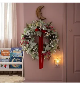 Christmas artificial plant wreath with red velvet bow and berries for holiday decor