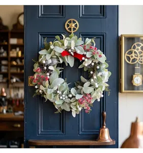 Christmas artificial wreath with velvet bow green leaves white red berries for holiday decor