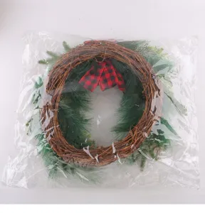 Christmas rattan wreath with red black plaid bow and pine branches for holiday door decor