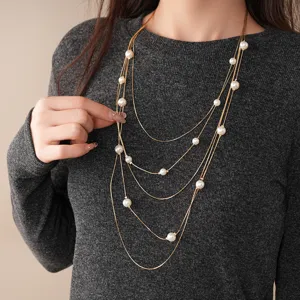 Multi-layer pearl sweater chain for women, elegant gold necklace fashion accessory for autumn.