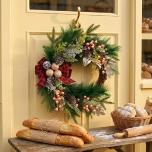 Christmas wreath with red black plaid bow pine branches pinecones door hanging decoration
