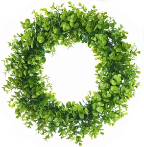 Artificial eucalyptus wreath detail showing lush green leaves for home and wall decor.