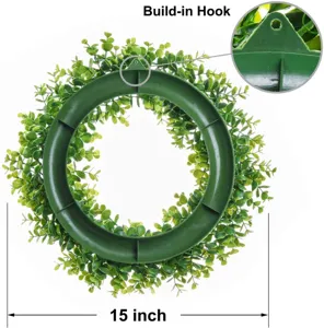 Detail view of the green eucalyptus wreath showing the built-in hanging hook and size.