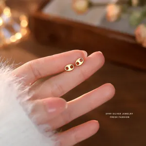 Minimalist S999 sterling silver pig nose stud earrings for women, chic daily jewelry gift.