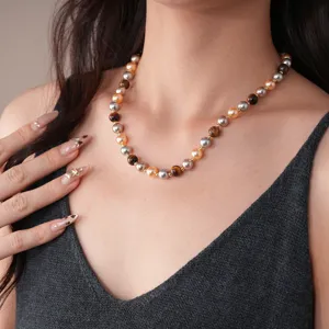 Elegant beaded necklace featuring natural tiger eye stones and metallic pearl beads.