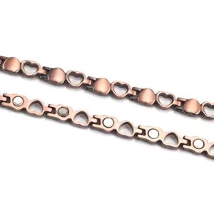 Vintage heart-shaped red copper magnetic therapy bracelet showing front and back details