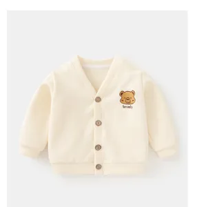 Detailed view of cream-colored baby cardigan with cute bear embroidery on the chest.