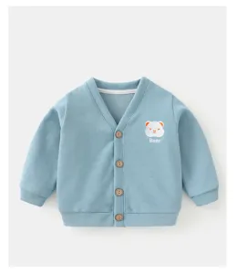 Close-up detail of infant light blue knit cardigan featuring cute bear embroidery