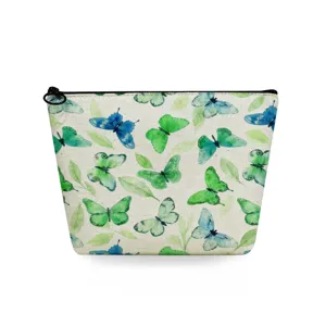 Detailed view of the watercolor butterfly print makeup bag with durable black zipper.