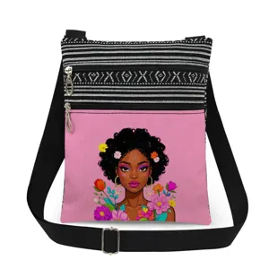 Close-up detail of the black girl floral print and double zipper structure on the stylish messenger bag.