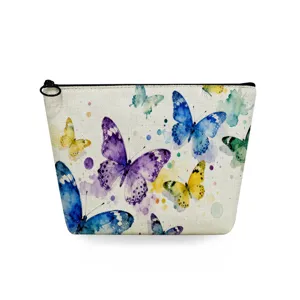 Close-up detail of the vibrant watercolor butterfly print and black zipper on the cosmetic pouch.