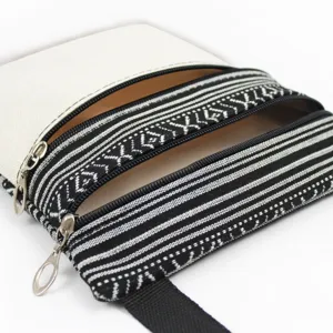 Canvas multi-zipper crossbody bag with black and white ethnic pattern, lightweight shoulder bag.