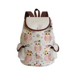 Close-up detail of the cute pink owl print canvas backpack featuring durable brown trim and pockets.