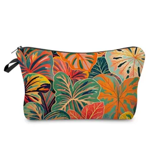 Detailed view of fashionable tropical leaf print cosmetic pouch with durable black zipper.