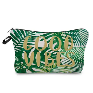 Tropical leaf pattern cosmetic pouch detail shot, featuring zipper closure and green fabric.