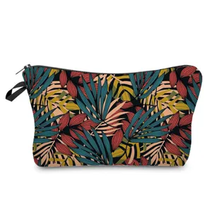 Detailed view of practical tropical leaf printed cosmetic bag, ideal daily travel pouch.