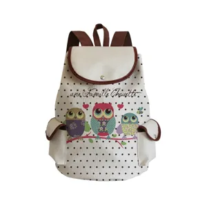 Canvas backpack detail showing cute owl family print, polka dot pattern and brown trim design.