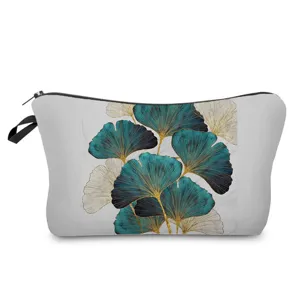Close up view of the stylish ginkgo leaf printed makeup pouch zipper detail and fabric.