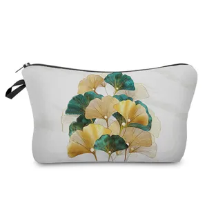 Ginkgo leaf pattern cosmetic bag detail showing the exquisite blue and gold foliage design.