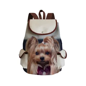 Close-up detail of the cute dog print and brown leather trim on the canvas backpack.