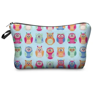 Close-up detail of the vibrant colorful owl pattern printed on the travel cosmetic pouch.