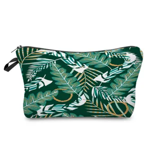 Close-up detail shot of tropical monstera leaf print cosmetic bag with secure zipper closure.
