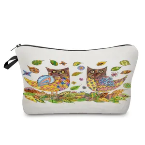Detailed view of a portable canvas makeup bag featuring a colorful artistic owl and leaf print design.