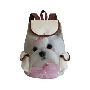 Canvas backpack detail showing cute white dog print and brown leather trim features.