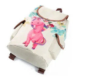 Close-up detail of the canvas backpack featuring a cute pink unicorn and floral print design.