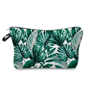 Detailed view of the tropical green leaf print cosmetic pouch, stylish waterproof toiletry bag.