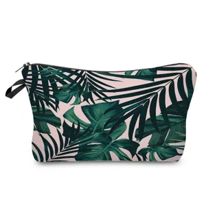 Tropical green leaf print makeup pouch detail shot, featuring zipper and durable fabric.