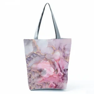 Detailed view of the stylish abstract printed tote bag featuring pink fluid art pattern.