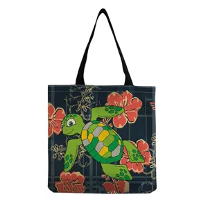 Close-up details of the canvas tote bag featuring cute sea turtle and floral print patterns.