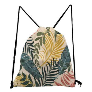Tropical leaf print drawstring backpack detail showcasing vibrant botanical pattern and black cords.