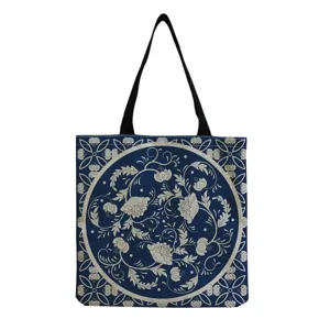 Blue and white vintage floral print tote bag detail, featuring classic pattern on dark fabric.