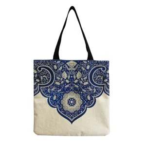 Detailed view of the blue and white ornate pattern tote bag, showcasing intricate floral canvas design.