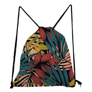 Detailed view of tropical leaf print drawstring backpack with colorful foliage pattern on black fabric.