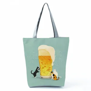 Sac cabas en toile avec imprimé chat et bière, sac à main tendance pour les courses quotidiennes.