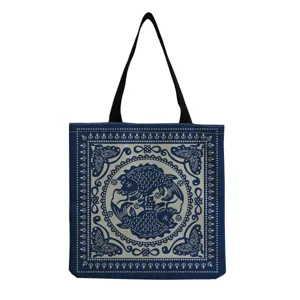 Traditional blue and white canvas tote bag featuring classic fish print, stylish shoulder bag.