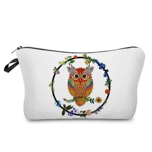 Detailed view of the colorful owl printed cosmetic bag, showing fine zipper and fabric.