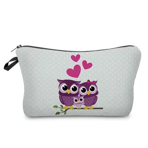 Close-up detail of the cute owl printed cosmetic storage bag featuring sweet heart patterns.