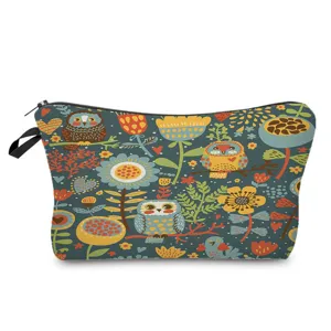 Close-up of the cute owl and floral print cosmetic pouch zipper and fabric texture detail view.