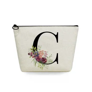 Canvas makeup bag featuring elegant letter C print and floral watercolor design detail.